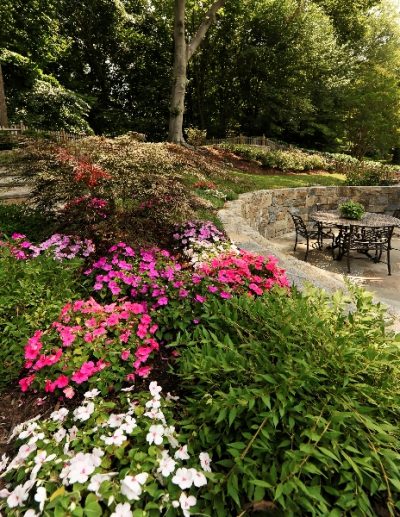Stone wall with colorful plantings