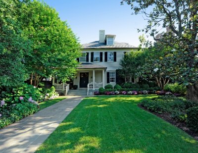 Green front yard with perfectly trimmed flower beds