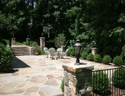 Stone patio with lights and plantings